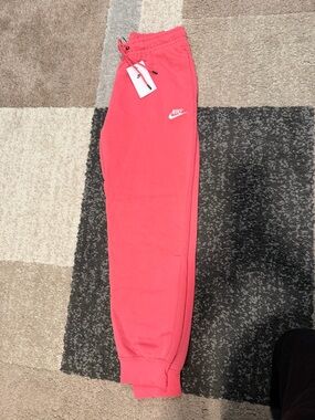 Nike women’s  Coral Pink Joggers with White Logo